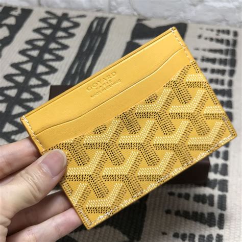 yellow goyard card holder